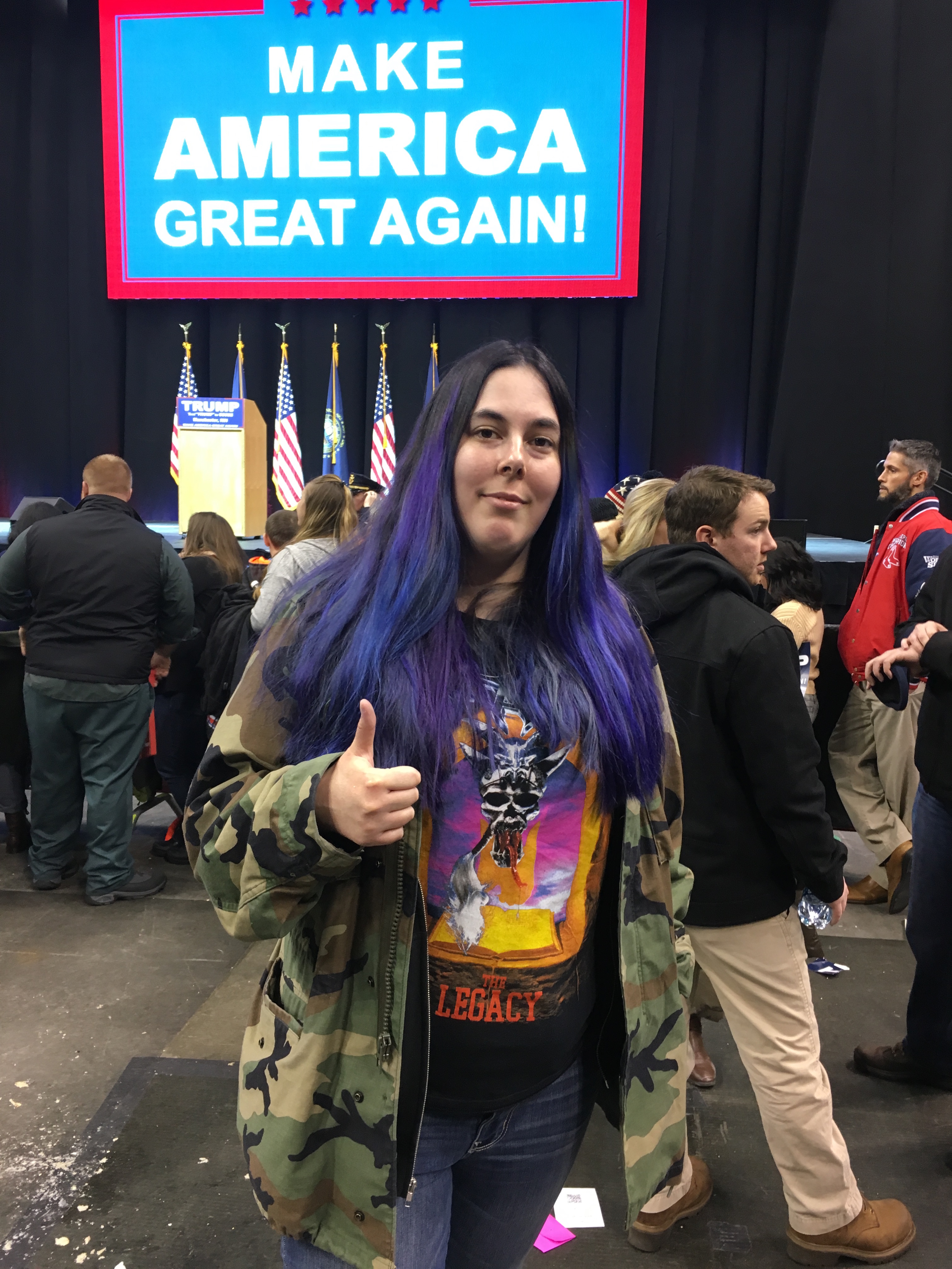 A picture of a young Trump supporter with Purple Hair
